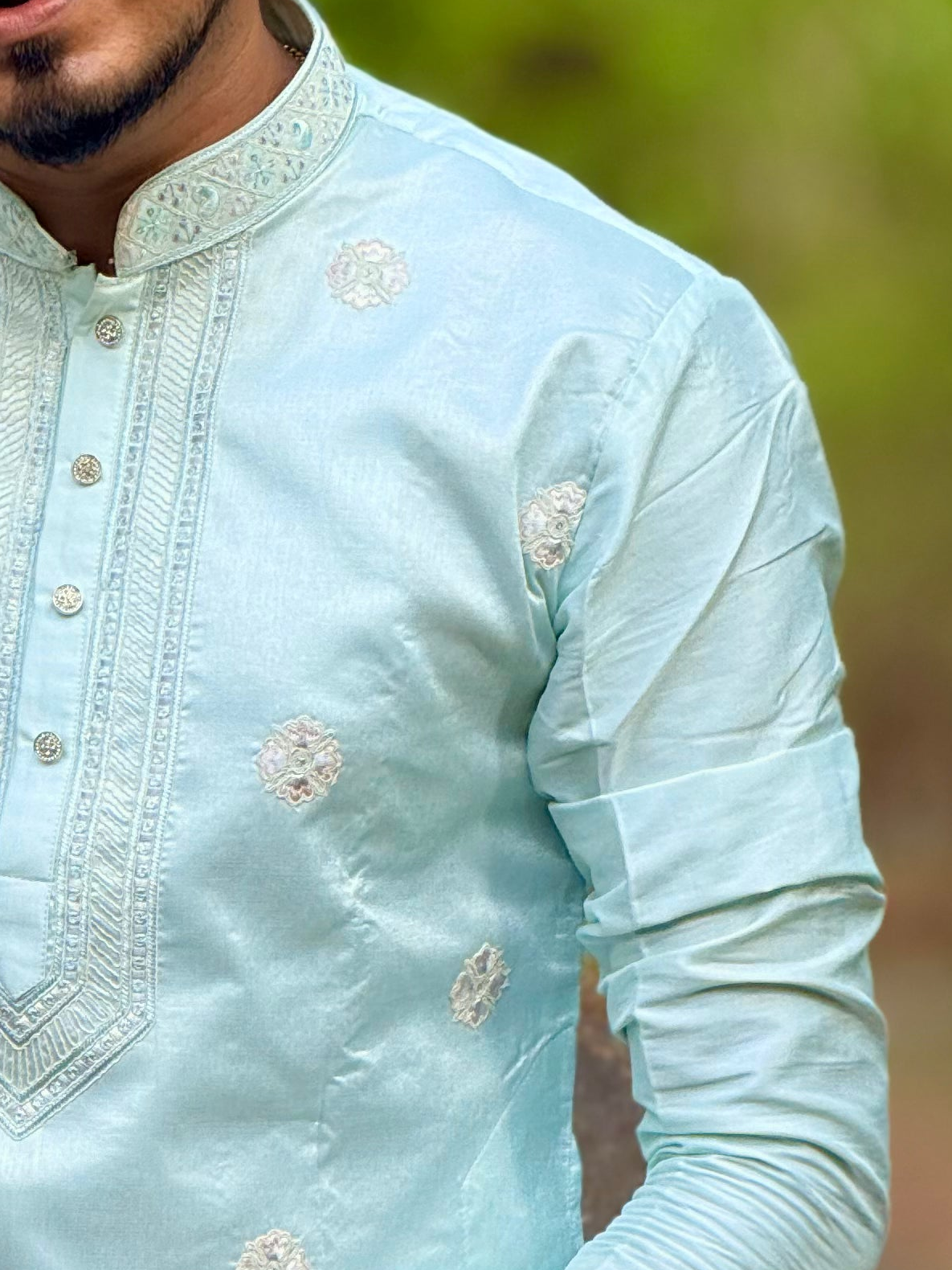 Sky blue neck work embroidered kurta.